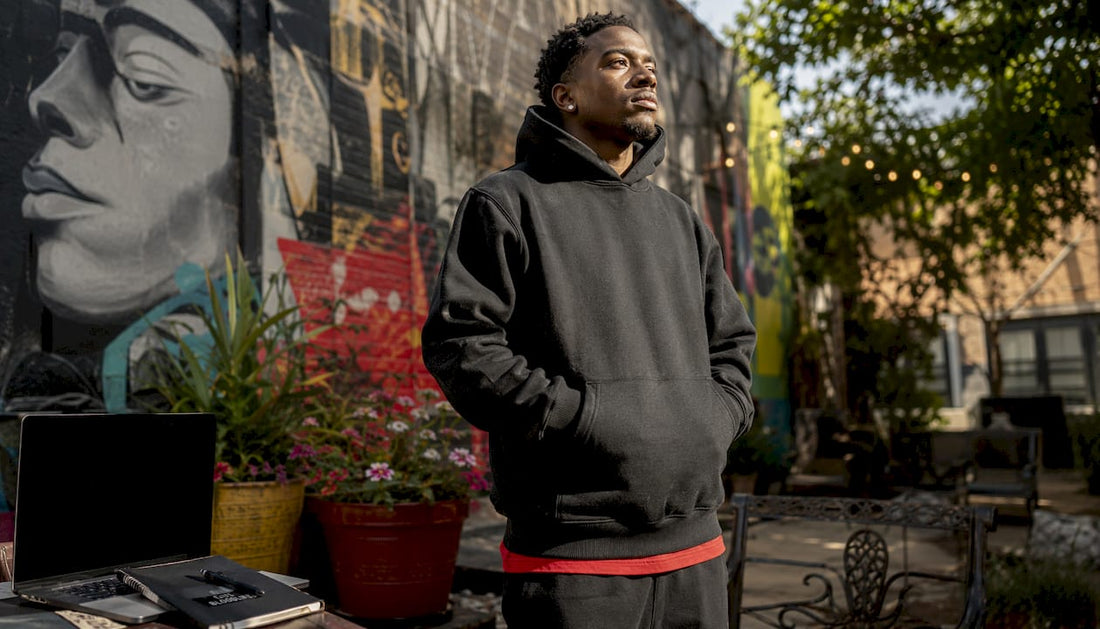 Young man in bold oversized streetwear hoodie outdoors
