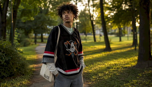 Young adult showing 2026 streetwear style outdoors