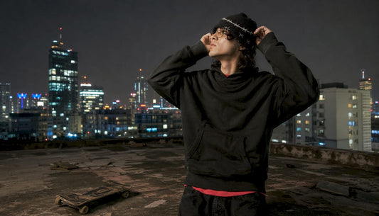 Person wearing barbed wire beanie on urban rooftop