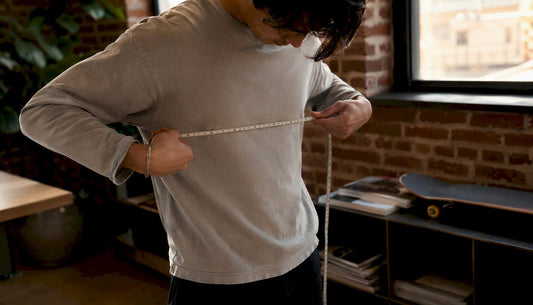 Person measuring chest with tape measure