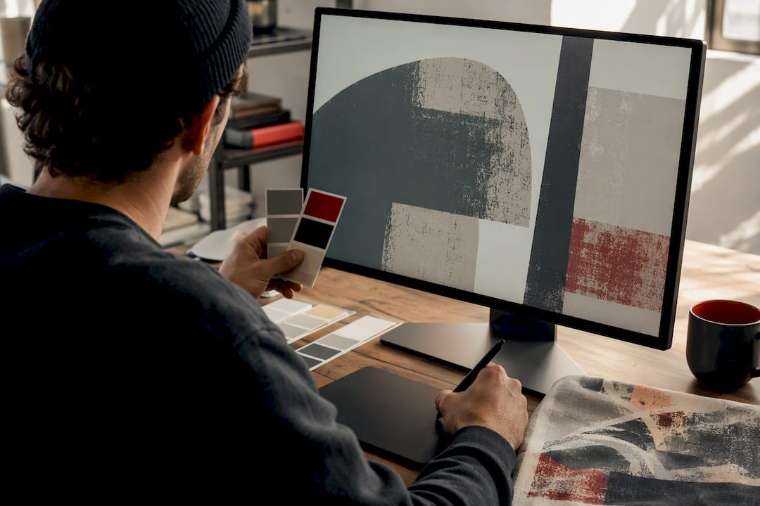 Designer reviewing retro print artwork