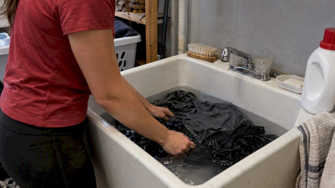 Damp gym clothes soaking in a utility sink