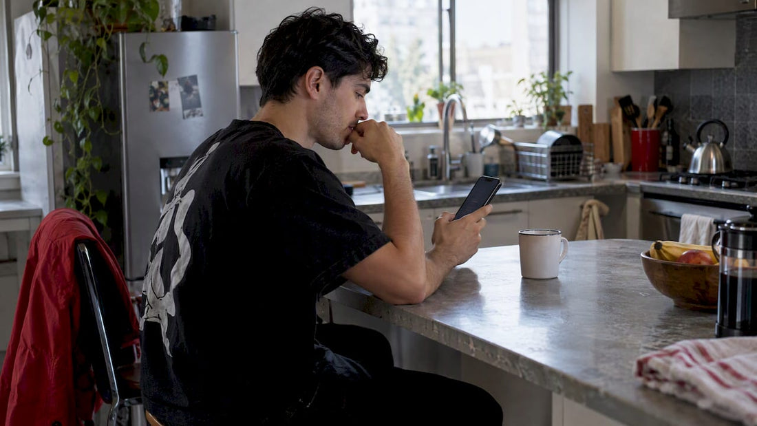 Streetwear fan checking a phone before a drop